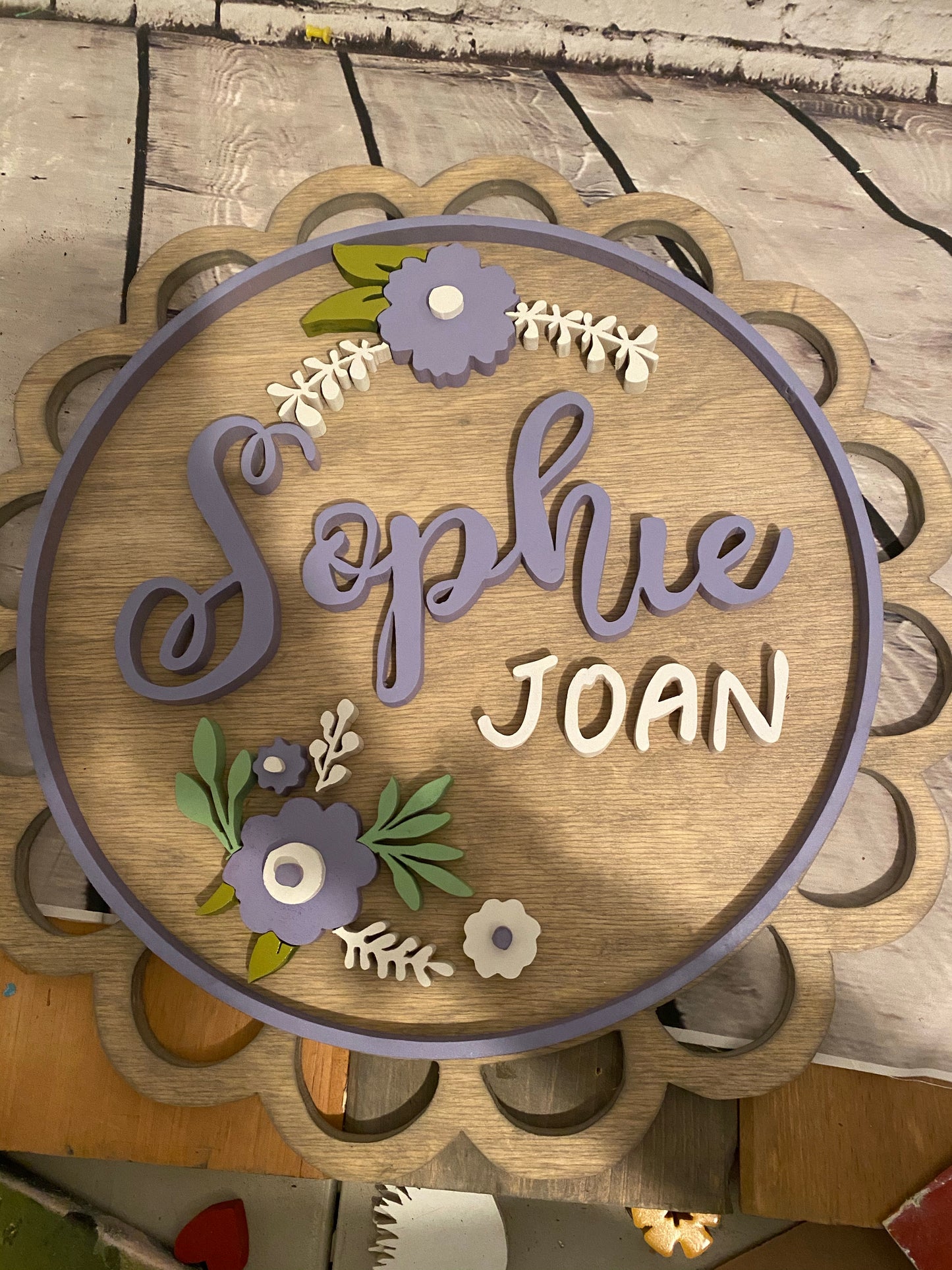 Round Nursery Name Sign with Flowers and scalloped edge with border